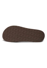 Semelle de chaussure en caoutchouc marron avec un motif en diamant texturé pour une traction optimale. La forme est large au niveau des orteils et se rétrécit vers le talon.