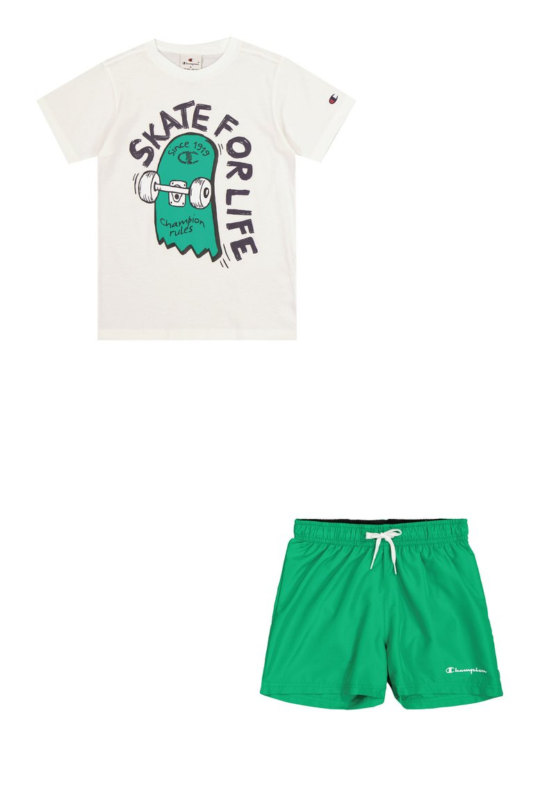 T-shirt bianca con grafica di uno skateboard verde e nero e la scritta "SKATE FOR LIFE." Costume da bagno verde con vita elastica e coulisse.