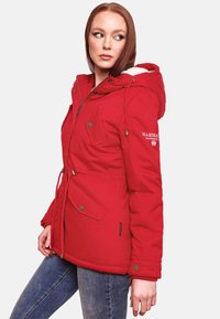Red insulated parka with a hood, featuring snap and drawstring closures, two front pockets, and embroidered branding on the sleeve.