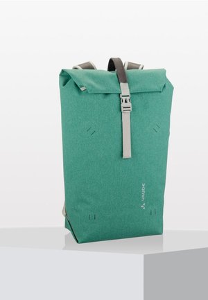 Teal roll-top backpack made of textured fabric, featuring gray straps and a buckle. Simple design with subtle branding and visible stitching details.