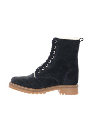 Navy suede ankle boot with brown rubber sole, featuring a fur-lined collar, round toe, and metal eyelets for laces.