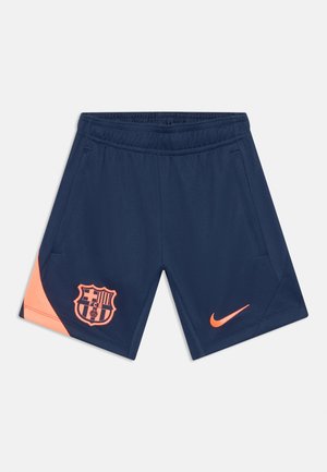 Navy blue sports shorts with elastic waistband, coral Nike swoosh on right leg, coral FC Barcelona logo on left leg, and side pockets.