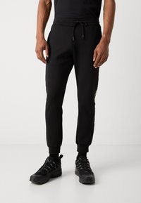 Antony Morato TROUSERS METAL EFFECT RUBBER LOGO - Pantalon de survêtement - black