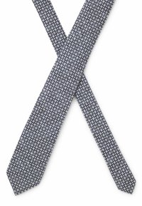 Marineblauwe stropdas met een klein bloemmotief, gemaakt van gestructureerde stof. Toegelopende uiteinden met een gladde afwerking, standaard stroodlengt.