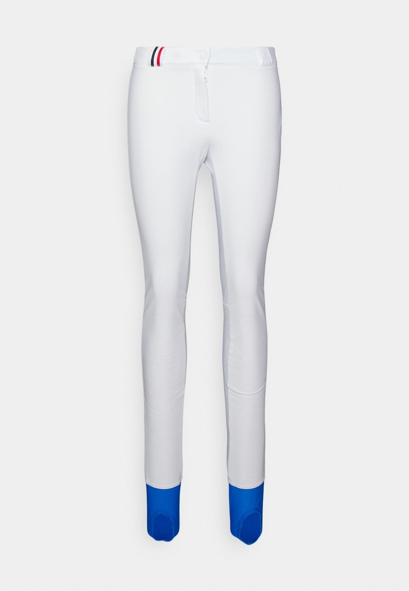 Pantalon blanc ajusté avec des couvre-pieds bleus et un petit détail rayé rouge, blanc et noir à la taille.