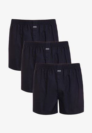 Navy blue boxers made of breathable fabric with an elastic waistband. Three pairs are stacked, featuring a small logo patch on the front.