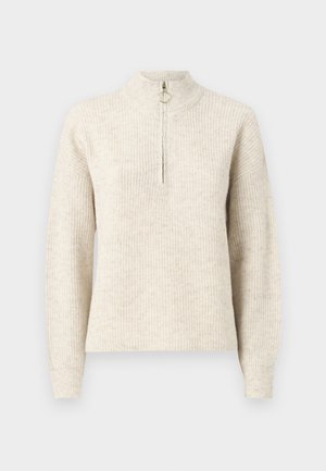 Pull en maille côtelée beige clair avec un col haut, fermeture zippée quart et manches longues. Texture douce avec un motif subtil.