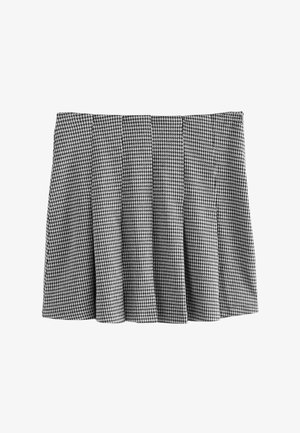 Sort-hvidt hundetandmønsteret plisseret nederdel med elastisk talje, lavet af tekstureret stof, der illustrerer en struktureret design.