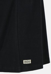 Black cotton t-shirt featuring a straight hem, side seam, and a small woven label with "DENIM FACTORY" near the bottom.