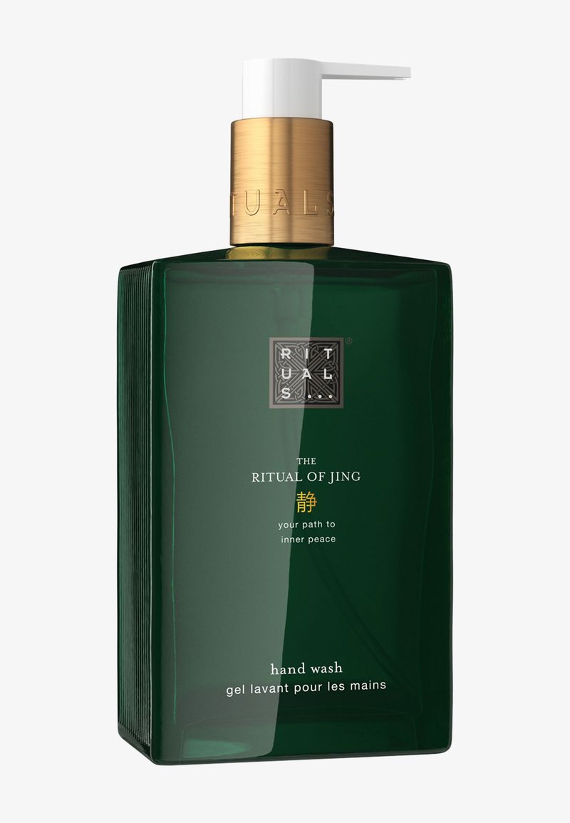 Donkergroene glazen handwasfles met een witte pomp en gouden accent. Bevat een textuur logo en label met Engelse en Franse tekst.