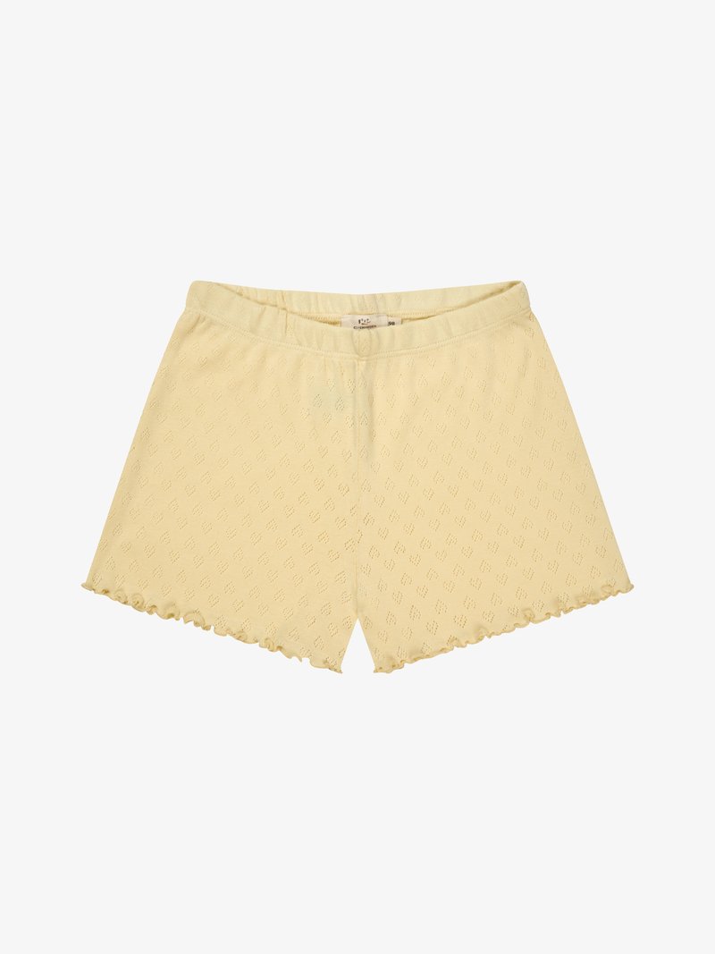 Shorts en maille jaune clair avec taille élastique et ourlet festonné, présentant un motif de losanges subtil sur tout le tissu.
