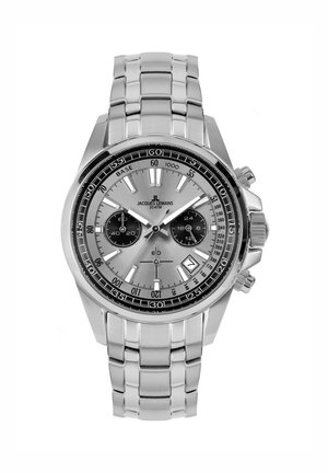 Edelstahl-Chronographenuhr mit silbernem Zifferblatt, schwarzen Nebenziffern, leuchtenden Markierungen und einem gemusterten Armband. Datumsanzeige bei 4 Uhr.