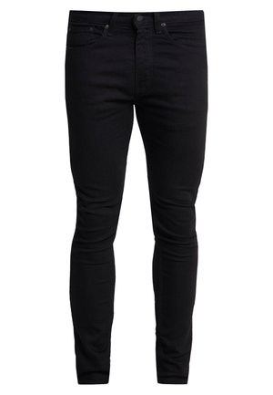 Sorte skinny jeans laget av denim, med et klassisk fem-lomme-design, beltehemper og glidelås med knappelukking.