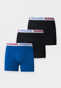 Τρία ζευγάρια μποξέρ σε μπλε και μαύρο χρώμα με λευκές ελαστικές ζώνες μέσης που έχουν το κείμενο «BJÖRN BORG FRANCE» σε κόκκινο και μπλε.