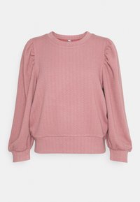 Różowy sweter dziewiarski z bufkami na długich rękawach, ściągaczami i strukturalnym pionowym wzorem w zygzaki.