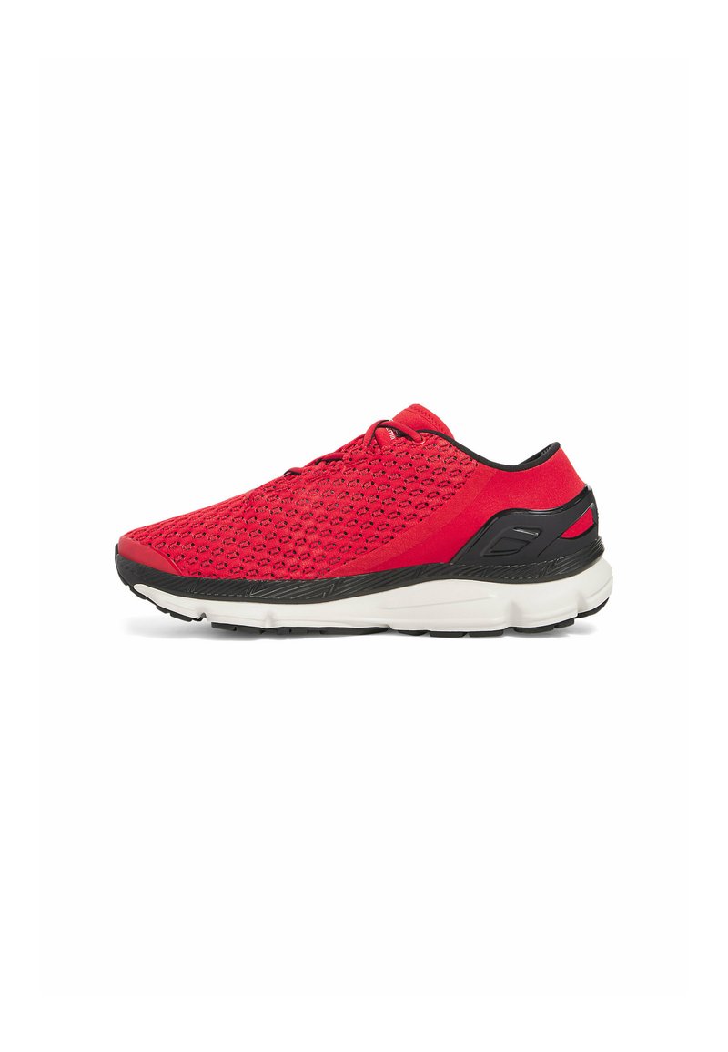 Red athletic shoe with a textured mesh upper, black accents, and a cushioned white sole. Features a secure lace-up design.