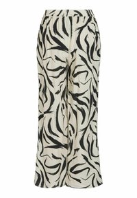 Pantalon large en tissu léger, avec un fond crème orné de motifs abstraits en coups de pinceau noirs et une taille élastique.