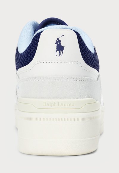 White sneaker with navy mesh accents. Features suede detailing, flat rubber sole, and small navy logo on heel. "Ralph Lauren" embossed on side.
