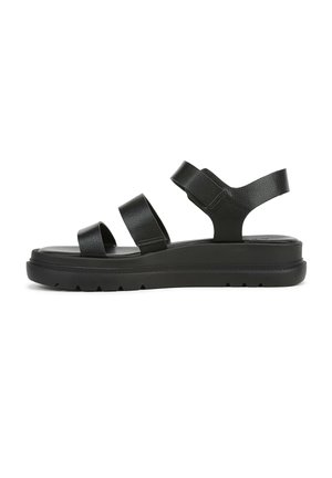 Black leather sandals with three wide straps, cushioned footbed, and a thick, textured black rubber sole featuring traction patterns.