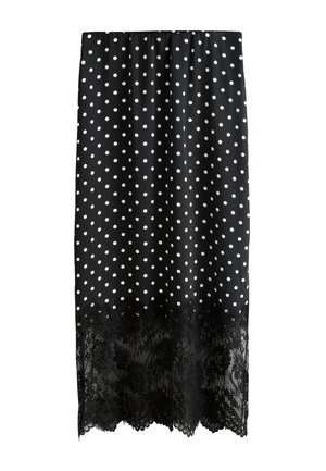 Gonna midi nera con pois bianchi e orlo in pizzo nero, con vita elasticizzata.