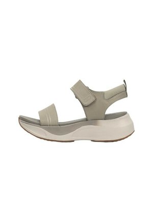 Sanda blanca con dos correas ajustables, tejido suave y una suela gruesa y acolchada. Presenta una punta redondeada y una plantilla texturizada.