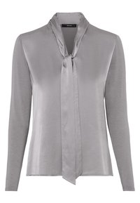 Blusa grigia a maniche lunghe con una texture morbida e lucente, caratterizzata da un dettaglio al collo annodato e una vestibilità rilassata. Tessuto liscio con cuciture minime.