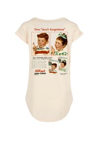 Cream-colored T-shirt featuring vintage Kellogg's Corn Flakes advertisements, illustrated children, graphic text, and curved hem design.