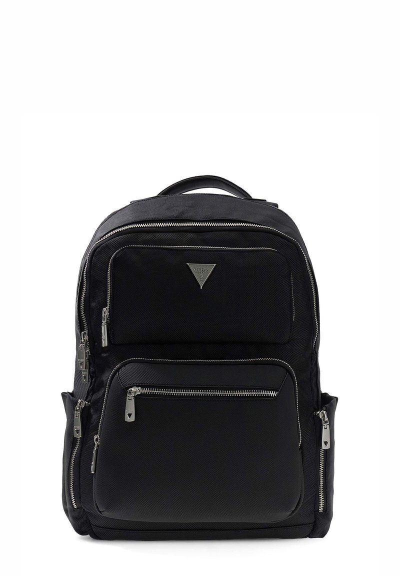 Black fabric backpack with multiple zippered pockets, a triangular logo, and silver hardware accents. Adjustable straps and top handle included.