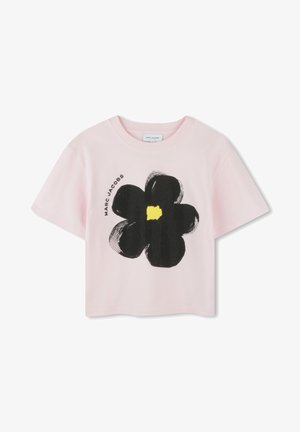Pink cotton t-shirt with a cropped design. Features a large black flower graphic and yellow center. "Marc Jacobs" printed in black.