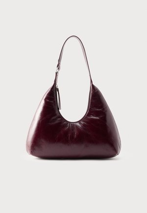 Dark burgundy leather shoulder bag with a smooth, glossy finish and a single strap with silver buckle detail.
