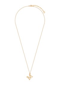 Złoty naszyjnik z cienkim łańcuchem i wisiorkiem w kształcie litery "M". Wisiorek jest gładki i wypolerowany, odbijający światło.