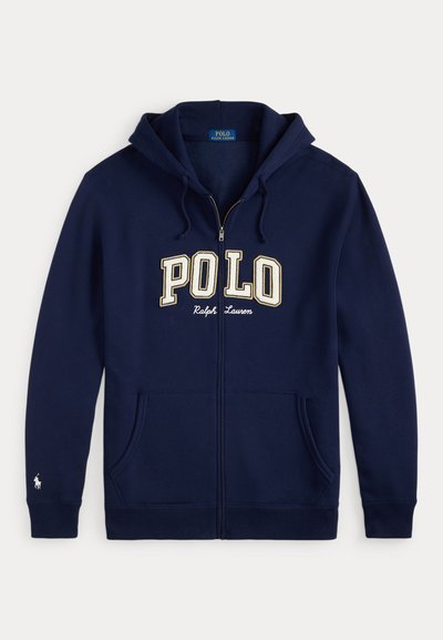Sweatshirt com fecho de correr azul-marinho feita de mistura de algodão, com um grande logótipo "POLO" em creme, bolsos frontais e capuz com cordão.