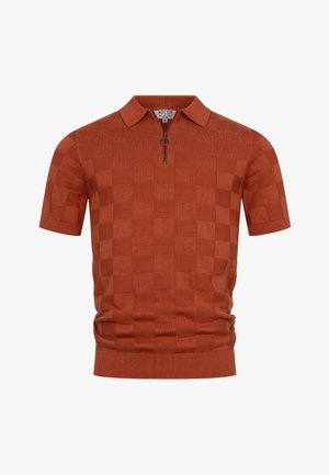 Kortarmige polo in roestoranje met een subtiel geruit patroon en een rits aan de voorkant met een ronde trekker, voorzien van het merk "Indicode" bij de kraag.