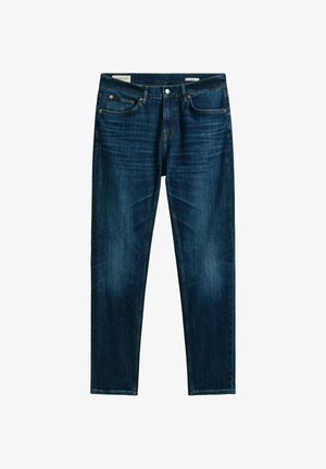 Dunkelblaue Slim-Fit-Jeans mit Vorderentaschen, Gürtelschlaufen und Knopfverschluss, flach auf weißem Hintergrund präsentiert.