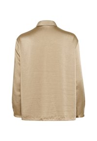 Short-sleeve, collared shirt in a light beige, satin-like fabric with a subtle sheen, featuring a straight hem and side slits.