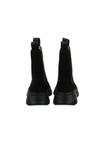 Botas de tobillo de ante negro con suela de goma lisa. Presentan lados elásticos, lengüetas para facilitar el calzado y una silueta elegante. Parte superior texturizada y diseño robusto.