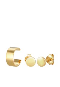 Conjunto de joyería en tono dorado que incluye una ancha pulsera de tipo brazalete y dos pendientes de botón redondos a juego. Superficie lisa y reflectante con un diseño minimalista.