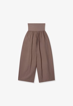 High-waisted wide-leg trousers in muted brown with gathered waistband and loose, flowy fabric.