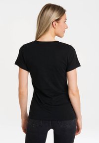 Black cotton t-shirt with short sleeves, round neckline, and a fitted design, shown from the back against a white background.