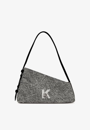 Gray fabric shoulder bag with an angular design, featuring a black strap and a prominent white “K” logo on the front.