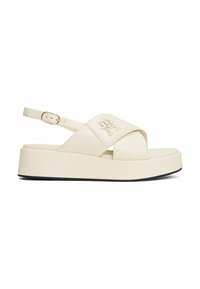Crème kleur platform sandalen met een kruisriemontwerp, voorzien van een logo patch, verstelbare enkelriem en een gestructureerde zool.