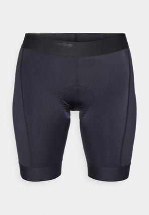 Melni braukšanas šorti, kas izgatavoti no gludas, elastīgas auduma. To iezīme ir polsterēta sēdeklis un elastīgs jostasvieta, lai nodrošinātu komfortu braucienu laikā.