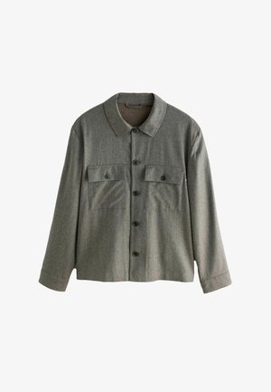 Grå tekstureret jakke med krave, frontlukning med knapper og to brystlommer med sorte knapper. Lange ærmer med lige manchetter.