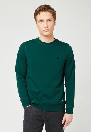 Felpa crewneck verde realizzata in cotone con polsini a costine. Presenta un piccolo logo di un albero nero sul petto e un orlo rotondo.