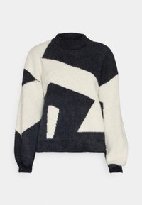 Pulover tricotat cu modele geometrice în culori negru și crem, texturat, prezentând un guler înalt și mâneci lungi.