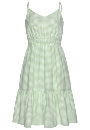 Robe sans manches en vichy vert clair et blanc avec fines bretelles, taille élastiquée, encolure en V et ourlet volanté.