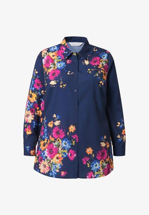 Chemise marine à motif floral en rose, orange et bleu. Présente un col, des manches longues et une fermeture à boutons. Texture de tissu lisse.