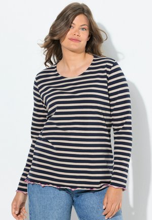 Long-sleeve navy and beige striped shirt made of soft fabric. Features a round neckline and a wavy pink-accented hem. Pair with blue jeans.