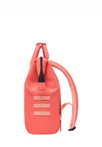 Coral backpack with a sleek design, nylon material, and black zipper. Features three horizontal straps and padded shoulder straps.