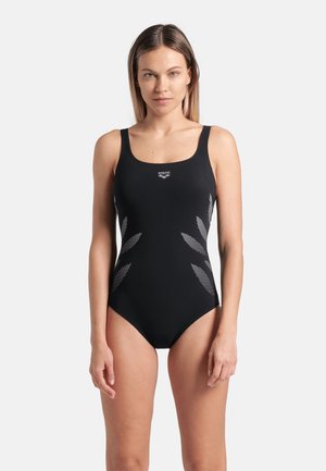 Black one-piece swimsuit with wide straps, featuring a logo on the chest and leaf-like silver patterns on the sides. Smooth texture.